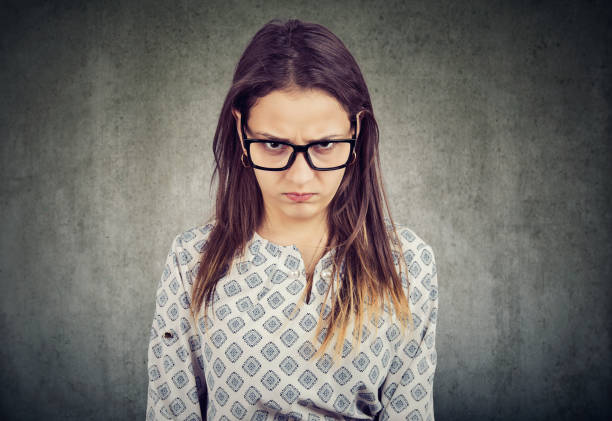istock Young serious angry woman in glasses 1225681200
