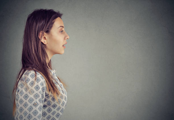 istock profile of a woman with open mouth 1225681275