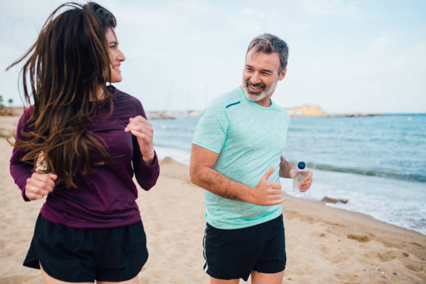 istock Couple on vacation enjoying morning run 1225684881
