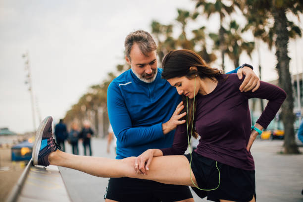 istock Couple stretching on the beach 1225684917
