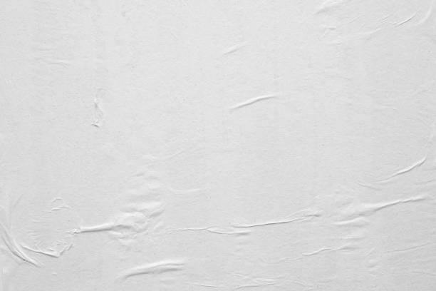 istock Blank white crumpled and creased paper poster texture background 1225685508