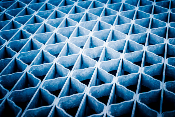 blue toned metal grating on the street drain, Saskatoon, SK, Canada.