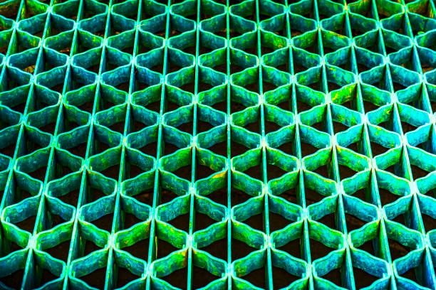 colorful  metal grating on the street drain, Saskatoon, SK, Canada.