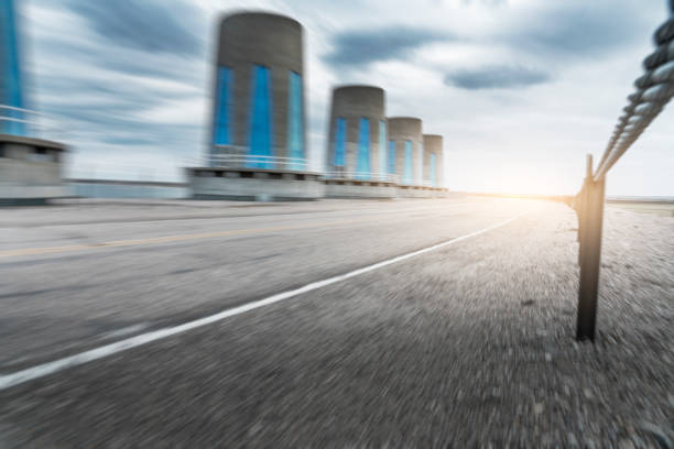 highway road with hydroelectric power station, SK, Canada.