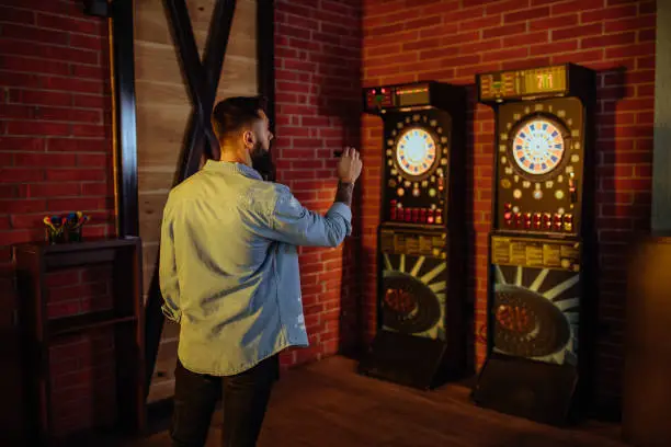 Photo of Playing darts