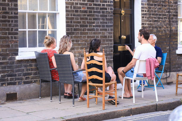 Coronavirus outbreak in the UK London, England - May 08, 2020. Members of the public celebrate VE DAY 75 in the neighborhood central London, following the guidance of authorities on social distancing Waterloo, London. ve day celebrations uk stock pictures, royalty-free photos & images