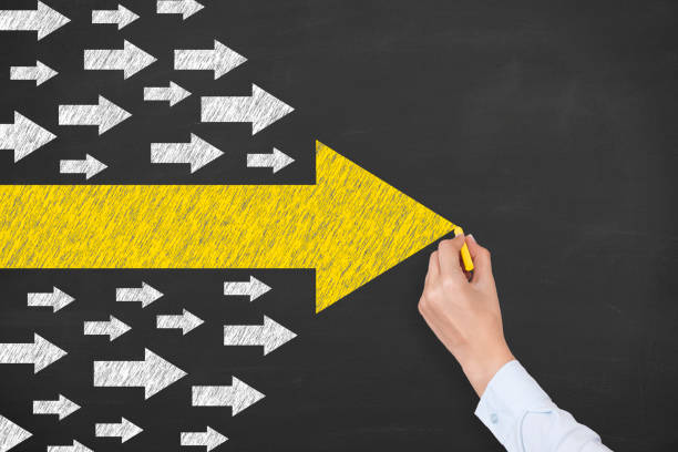 istock Leadership Concepts with Arrows on Blackboard Background 1225696378