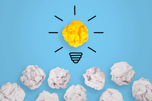 istock Creative Idea Concepts with Light Bulb Crumpled Paper on Blue Background 1225696390