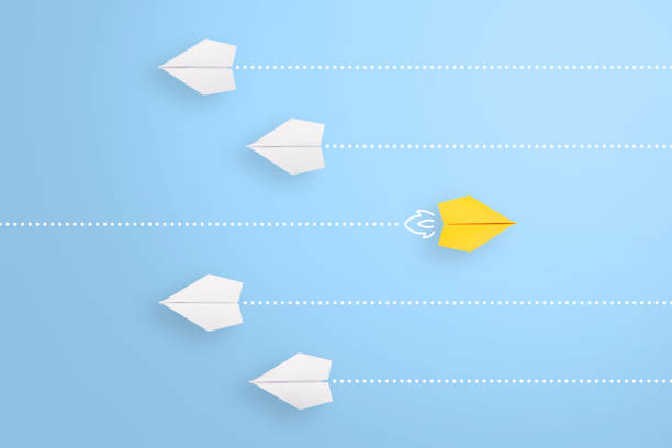 Change concepts with yellow paper airplane leading among white