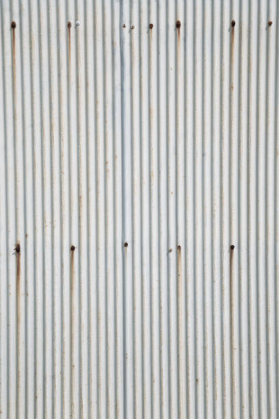 istock Gray rusty wavy metal plate wall background texture 1225700272