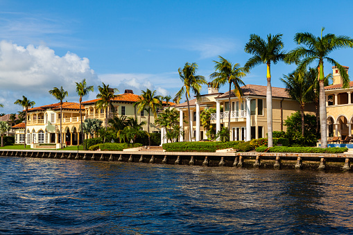 Luxury waterfront homes along the Fort Lauderdale intracoastal waterway viewed from a yacht.