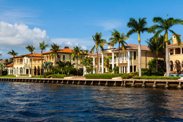 Luxury Homes Luxury waterfront homes along the Fort Lauderdale intracoastal waterway viewed from a yacht. promenade photos stock pictures, royalty-free photos & images