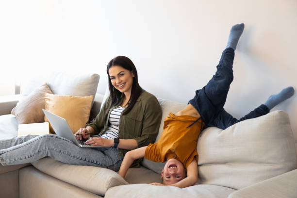istock Excited child having fun with mother in self-isolation at home 1225706418
