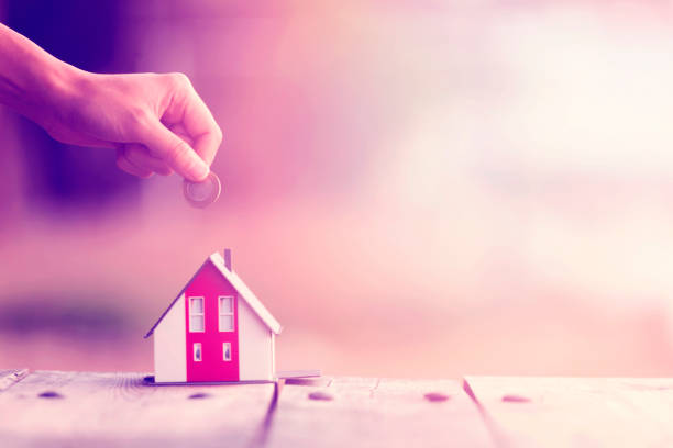 istock Real Estate Agent with house model and saving concepts 1225706853
