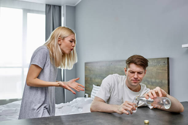 istock desperate wife yells at her husband's drunk 1225716396