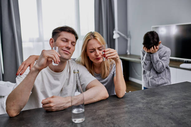 istock unscrupulous parents drink alcohol together at home 1225716428