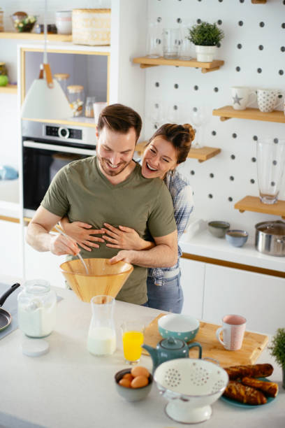 istock Young couple making pancakes at home. 1225720652
