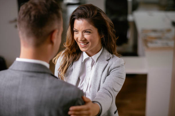 istock Young woman and man flirting in office. 1225720716