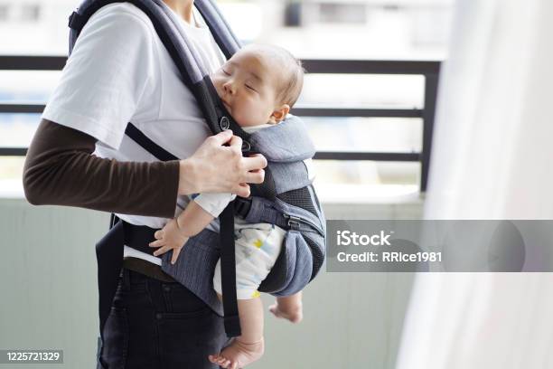 A Mother And Her Fivemonthold Baby On A Walk By Baby Carrier Stock Photo - Download Image Now