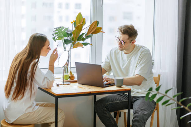 istock beautiful young couple spend morning differently 1225721359