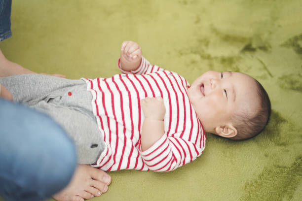 istock A five-month-old baby playing with his mother. 1225722285