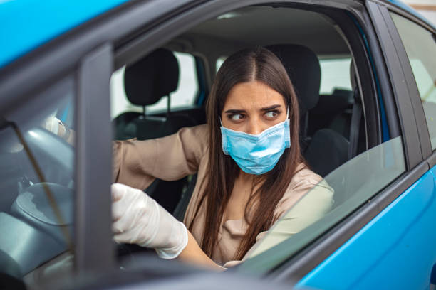 istock Young woman protect her self from Corona virus wearing protective mask 1225724502