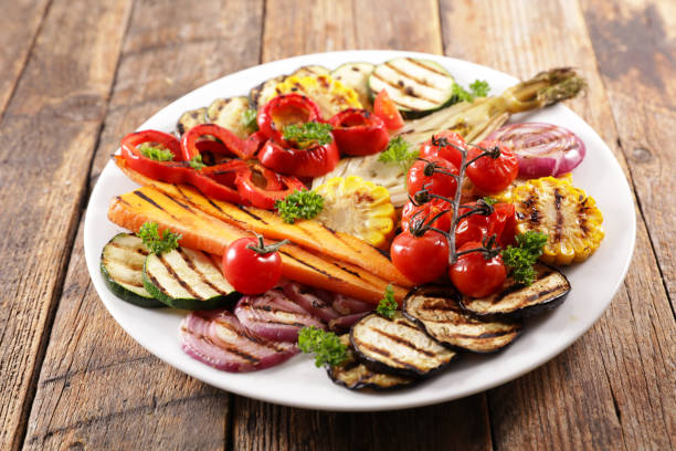 istock grilled colorful vegetables, aubergine, zucchini, bell pepper, celery, onion, corn with basil 1225724954
