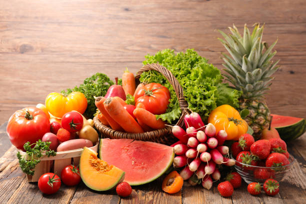 istock assorted of fruit and vegetable on wood background 1225725666