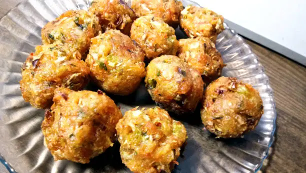 Photo of Veg Manchurian dry - Popular food of India made of cauliflower florets and other vegetable, selective focus