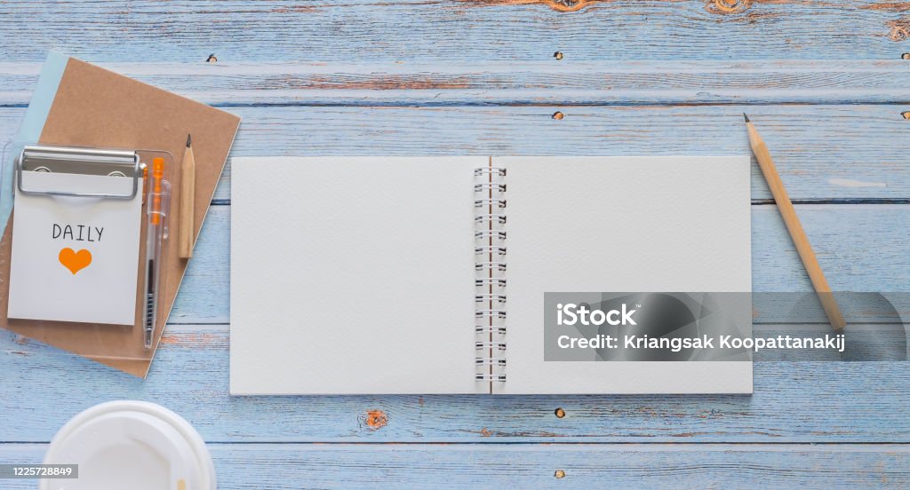 Top View White Binder Blank Notebook Or Diary Or Journal For Writing Text  And Message With Pencil And Coffee Cup On Blue Pastel Wood Background With  Copy Space Still Lifestyle Photo Concept