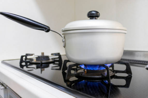 istock Metal pot heated by gas stove 1225729061