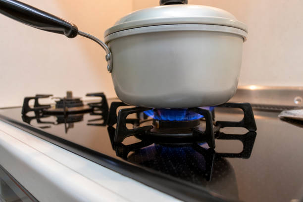 istock Metal pot heated by gas stove 1225729074