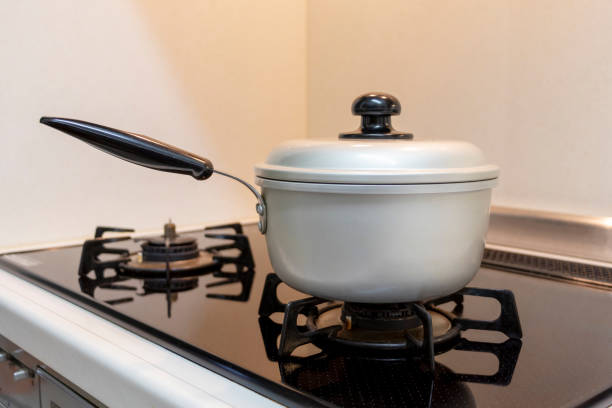 istock Metal pot heated by gas stove 1225729079