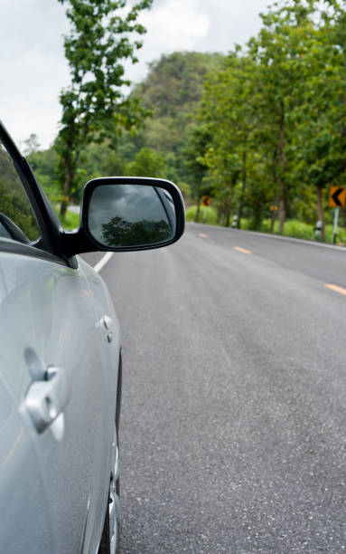 istock Rear side perspective view of car on road countryside 1225729894