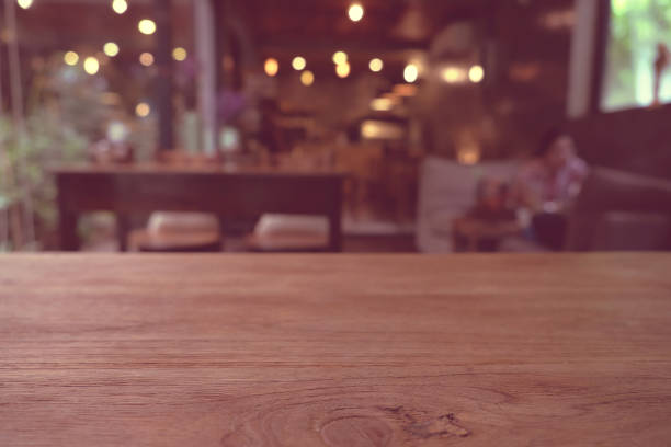istock Top of empty wood table with Bar Cafe Restaurant blurred background, product display template, Business presentation 1225729915