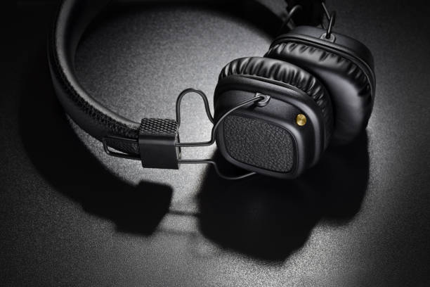 istock Wireless on-ear headphones on black background 1225731130