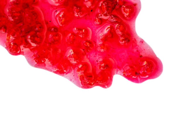 istock Raspberry jam drizzle isolated on white background. Fresh sweet confiture top view 1225732075