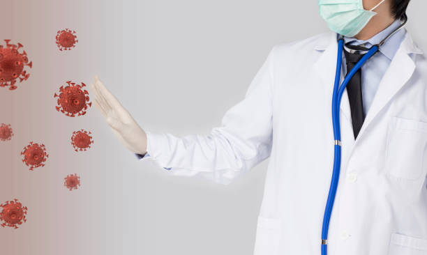 istock doctor pretends to prevent the virus 1225732131
