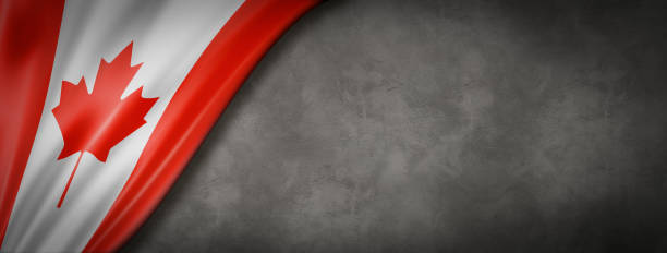 istock Canadian flag on concrete wall banner 1225732155