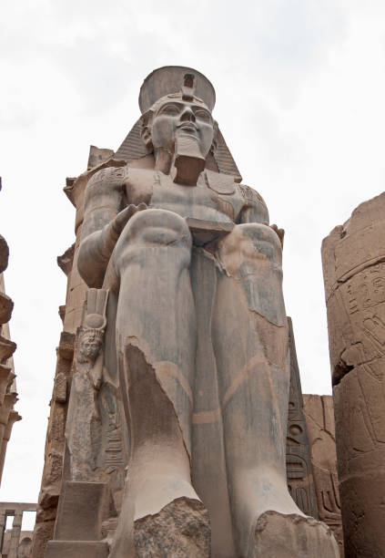 istock Statue and hieroglyphic carvings at an ancient egyptian temple 1225732240
