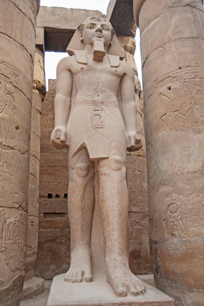 istock Statue and hieroglyphic carvings at an ancient egyptian temple 1225732271