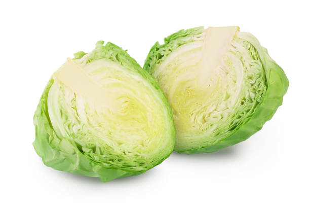 istock Green cabbage half isolated on white background with clipping path and full depth of field. 1225733238