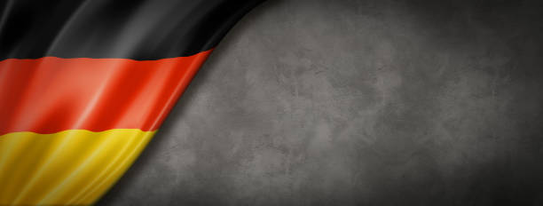 German flag on concrete wall banner Germany flag on concrete wall. Horizontal panoramic banner. german flag stock pictures, royalty-free photos & images
