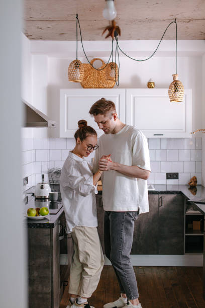 istock married couple in love, dance in kitchen 1225734771