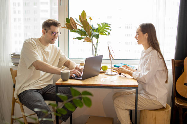 istock beautiful lady do make-up at morning while her husband work on laptop 1225735785