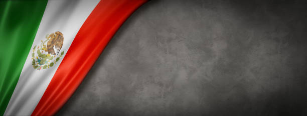 istock Mexican flag on concrete wall banner 1225736241