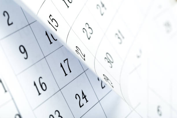 istock Closes a calendar page in blue. flipping calendar 1225737364
