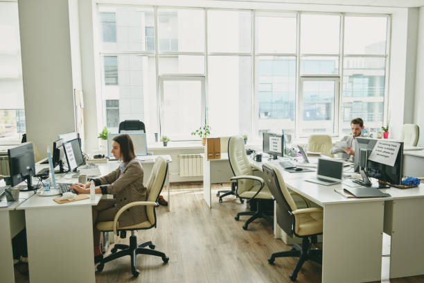istock People in office during coronavirus period 1225739159