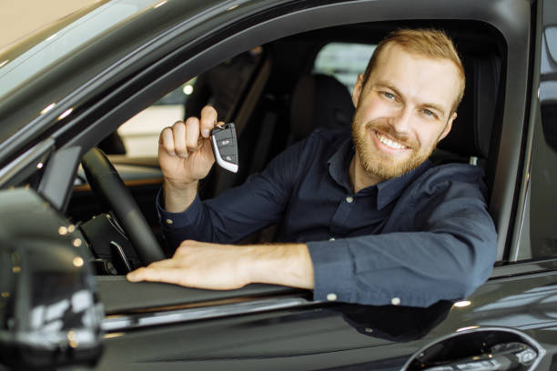 istock happy caucasian guy made purchase in dealership 1225740069