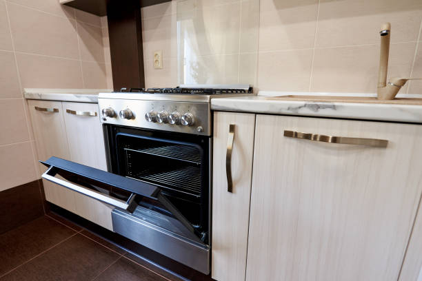 istock Open oven in an empty kitchen in an apartment. 1225740445